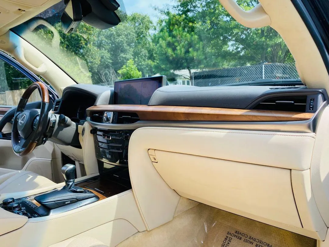Lexus LX 570 cabin with wood trim and infotainment screen